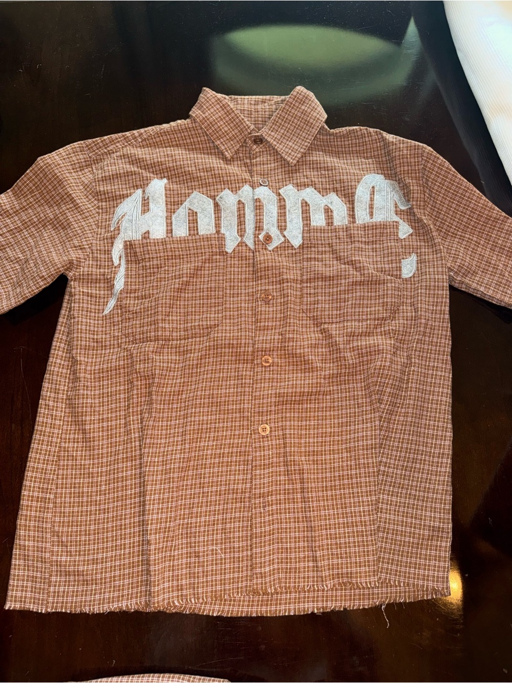 Men's Brown Plaid Button-Up Shirt with White Script Detail - M